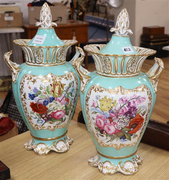 A pair of Ridgway turquoise and gilt ground two handled lidded vases, each painted with panels of garden flowers, height 42cm